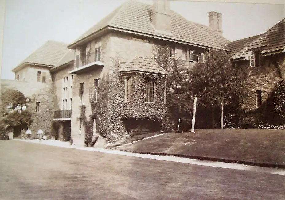 Old black and white external photo of Amberley function centre building and lawns
